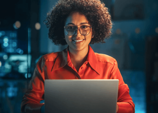 woman-staring-at-the-camera-with-a-laptop-in-front-of-her